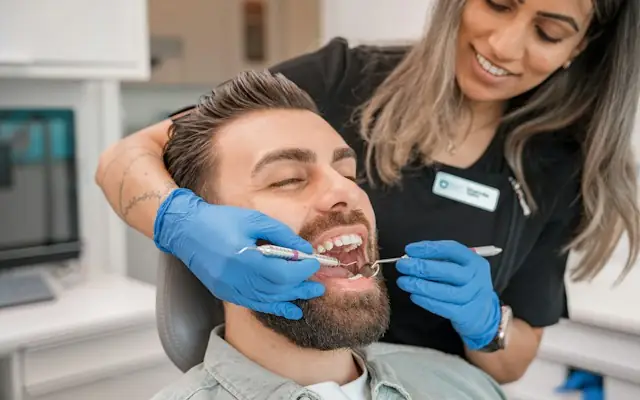 A dentist examining a patient’s teeth